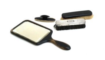 A Birks sterling silver clothes brush; together with a blotter; clothes brush and ebonised mirror