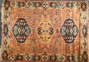 An orange ground rug, 181x130cm