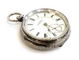 A large silver key wind open face fob watch, the white enamel dial signed 'G. Aaronson, Manchester',