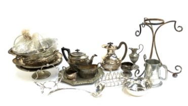 A large mixed lot of plated ware, three piece tea set; toast rack etc