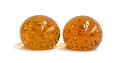 A pair of Whitefriars style orange glass bubble paperweights, each 6cmH
