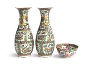 A pair of 19th century Chinese export famille rose vases, each with a gilt dragon, 31cm high (