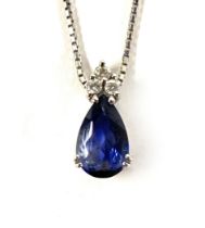 An 18ct white gold mounted sapphire and diamond pendant, the pear shaped sapphire measuring