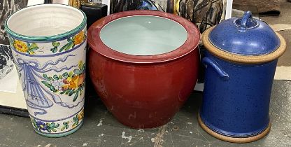 A majolica stick stand, 40cmH, red glazed planter, 31cmH and a stoneware lidded storage jar