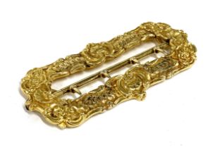 A heavy 19th century gold buckle, unmarked but tests as 18ct, with shell and floral motifs, 8cm