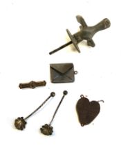 A small lot to include a 'Darling' brooch; silver stamp holder pendant etc