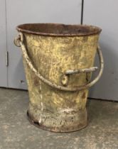 An antique fire bucket with iron loop handle, 43cmH