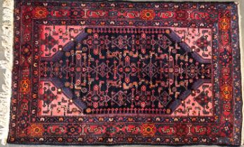 A red ground rug, 210x134cm