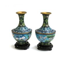 A pair of Chinese cloisonne enamel vases, depicting cranes and flowers, 25cm high, each on a