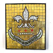 A mosaic fleur de lis crest with motto tiens a la verite, 35x31cm