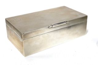 An engine turned silver cigarette box, Birmingham 1950, the top monogrammed 'H', 16.5x9x5cmH