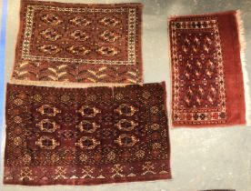 Three small tekke rugs, 84x142cm, 77x108cm, and 103x65cm