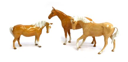 Three Beswick Palomino horse figurines, 17.5cmH, 20cmH and 14cmH (3)