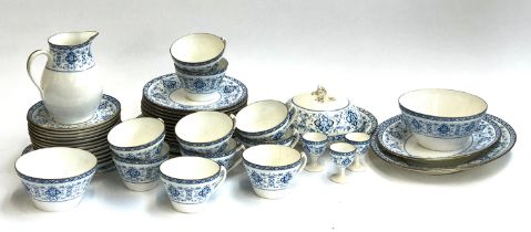 A Wedgwood part tea service comprising teacups, saucers, muffin dish, sugar bowl etc