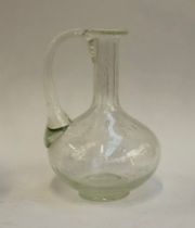 A large antique hand blown glass water jug with air bubbles, 26cmH