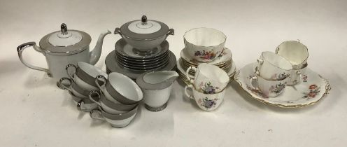 A Royal Crown Derby part tea set; together with a further white and grey Japanese tea set