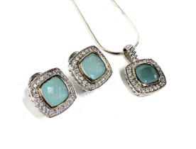 A silver pendant set with white stones and aquamarine glass, 1.5cmW, on a silver snake chain,