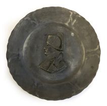 A 19th century French pewter dish after François-Charles de Franoz depicting Napoleon, 24cmD