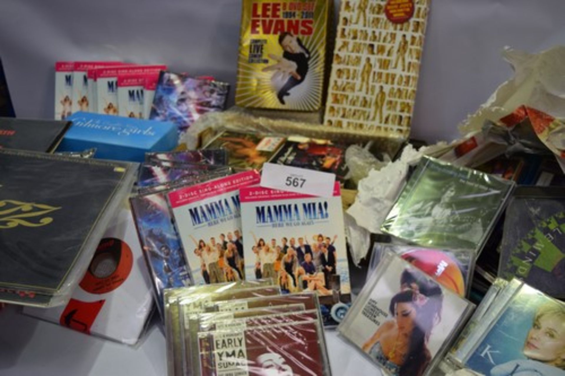 A large selection of CD's and DVD's including Mamma Mia, The Gilmore girls, Star Wars, Bon Jovi, and