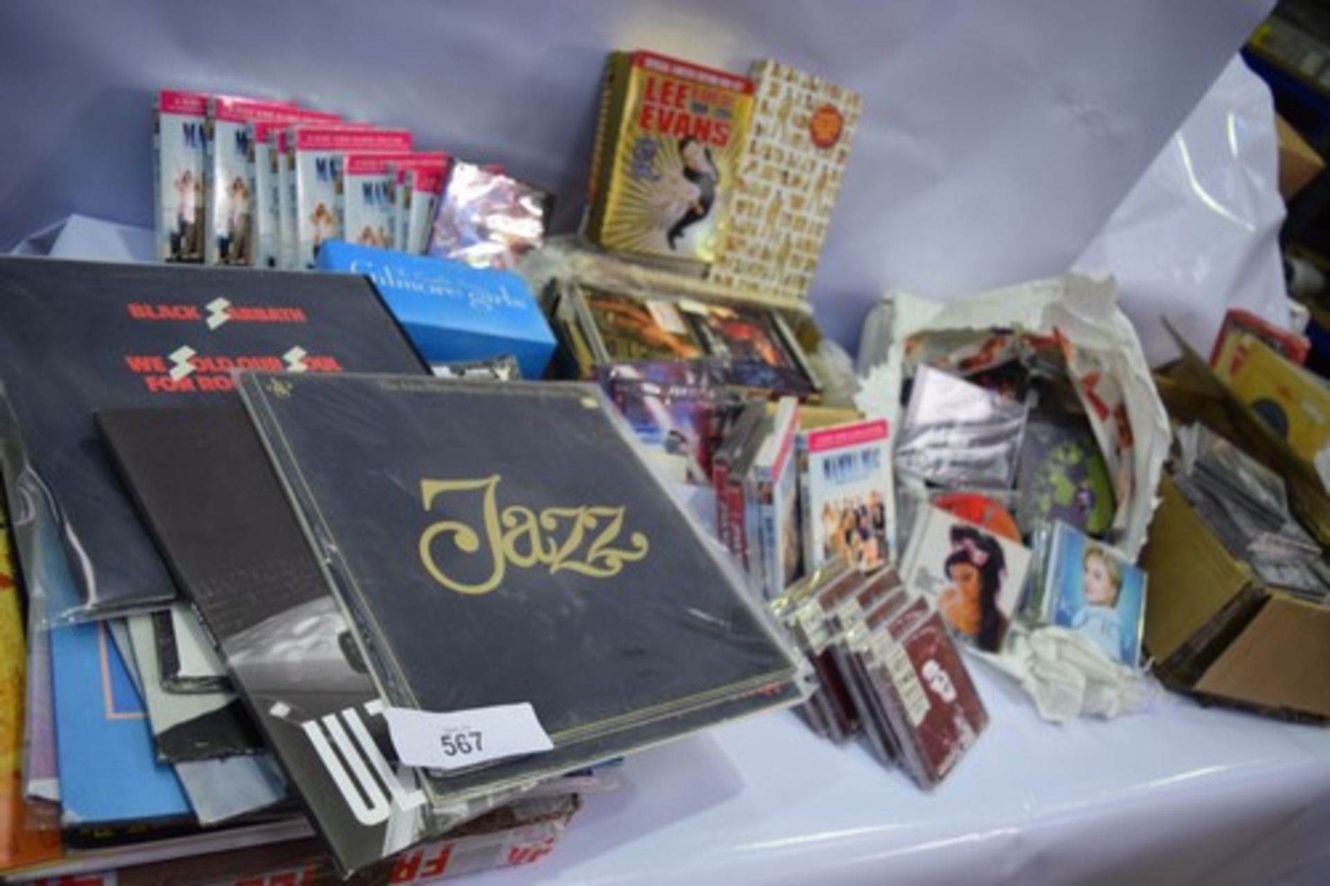 A large selection of CD's and DVD's including Mamma Mia, The Gilmore girls, Star Wars, Bon Jovi, and - Image 4 of 4