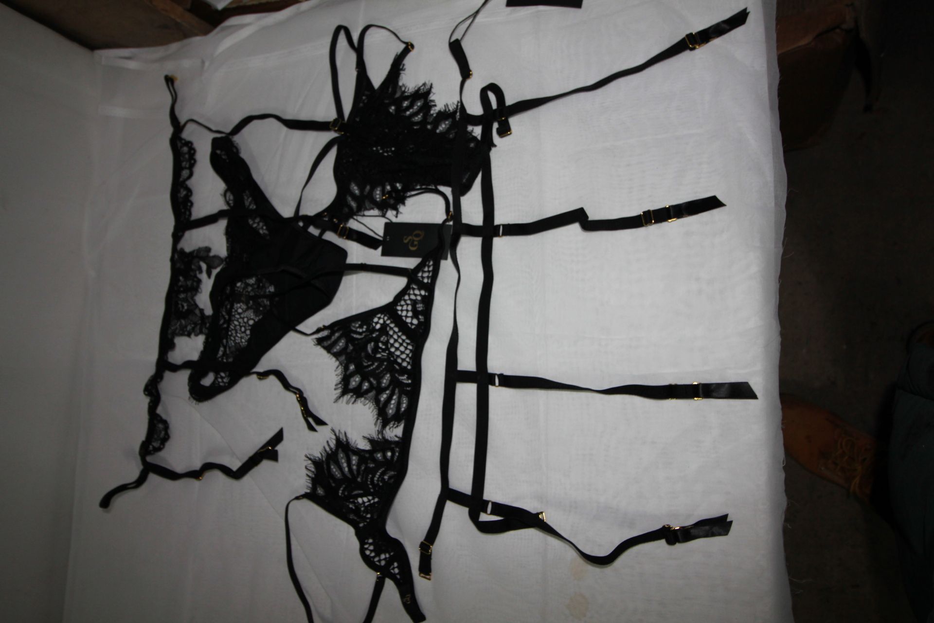 5 x Items of SGQ ladies under wear comprising 2 x suspender belts, 1 x bra and 2 briefs, all black
