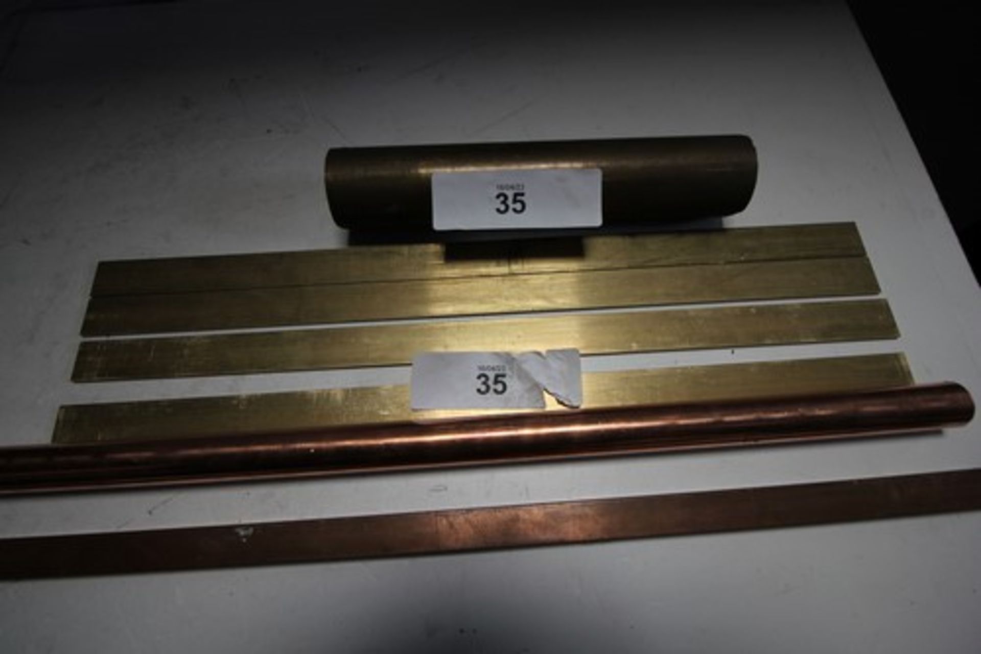 A selection of engineering brass and copper metal comprising 25mm x 4mm x 500mm, 20mm x 10mm x 1m