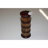 A mahogany spice tower, bearing labels 21cm high