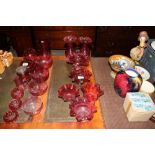 A collection of cranberry glassware to include two