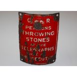 An enamel sign "Persons Throwing Stone At Telegrap