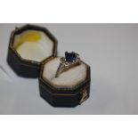 An 18ct white gold sapphire and diamond set ring,