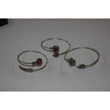 Three white metal and hardstone set bangles