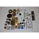 A box of various clock parts to include winding ke