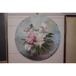 A hand painted floral decorated wall plate indisti