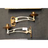 A pair of brass Art Nouveau style candle sconces