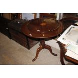 A 19th Century mahogany snap top table raised on t