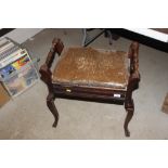 An Edwardian mahogany piano stool