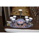 An Eastern enamel decorated carafe and goblets on