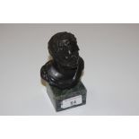 A bronzed bust in the form of a classical male rai