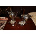 A silver plated and half fluted four piece tea set