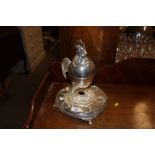 A silver plated egg cruet stand