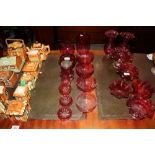 A collection of cranberry glassware to include vas