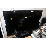 A Toshiba flat screen television with remote contr