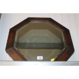 An octangular bevel edged wall mirror