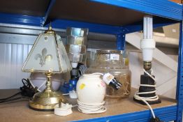A collection of various table lamps and shades