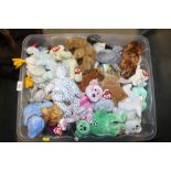 A box containing various Beany Babies etc