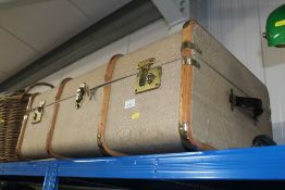A wooden and metal bound travelling trunk