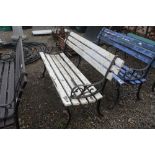 A wooden and metal garden bench