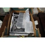 A box containing various photographs and negative