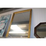 A gilt framed oblong wall mirror