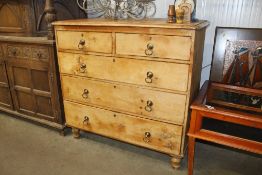An antique pine chest fitted two short over three